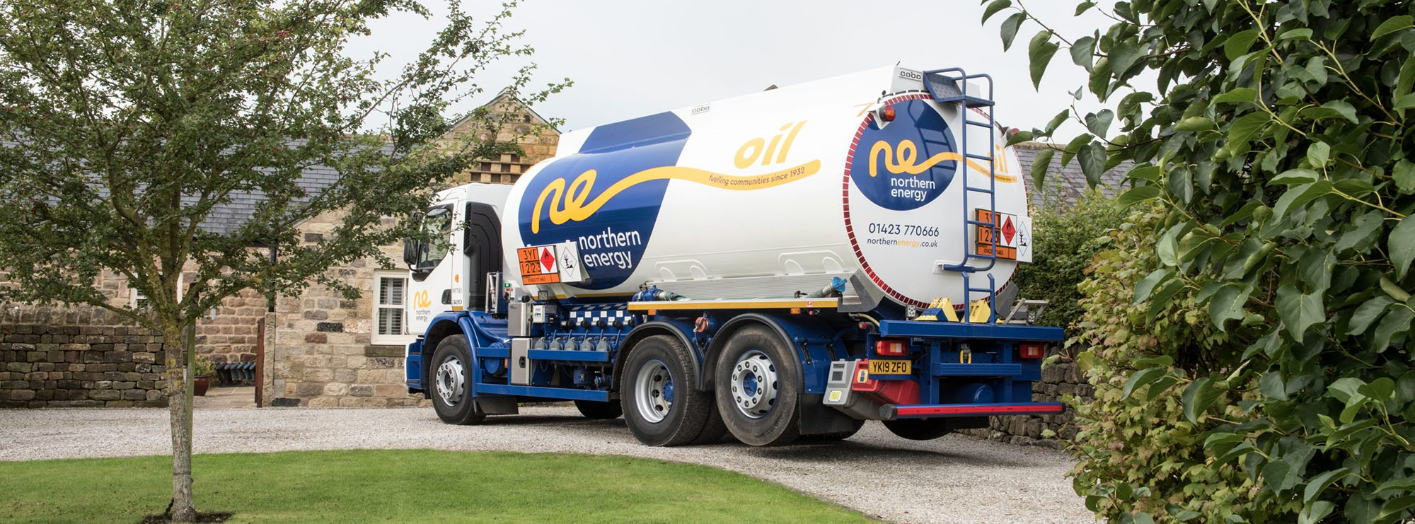 Northern Energy Oil truck pulling up to a house