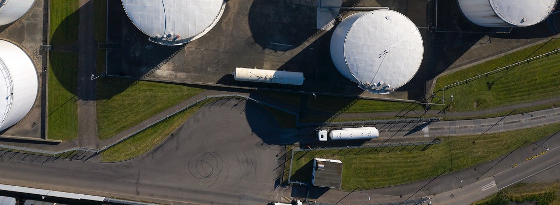 overhead-view-oil-trucks-and-big-fuel-tanks